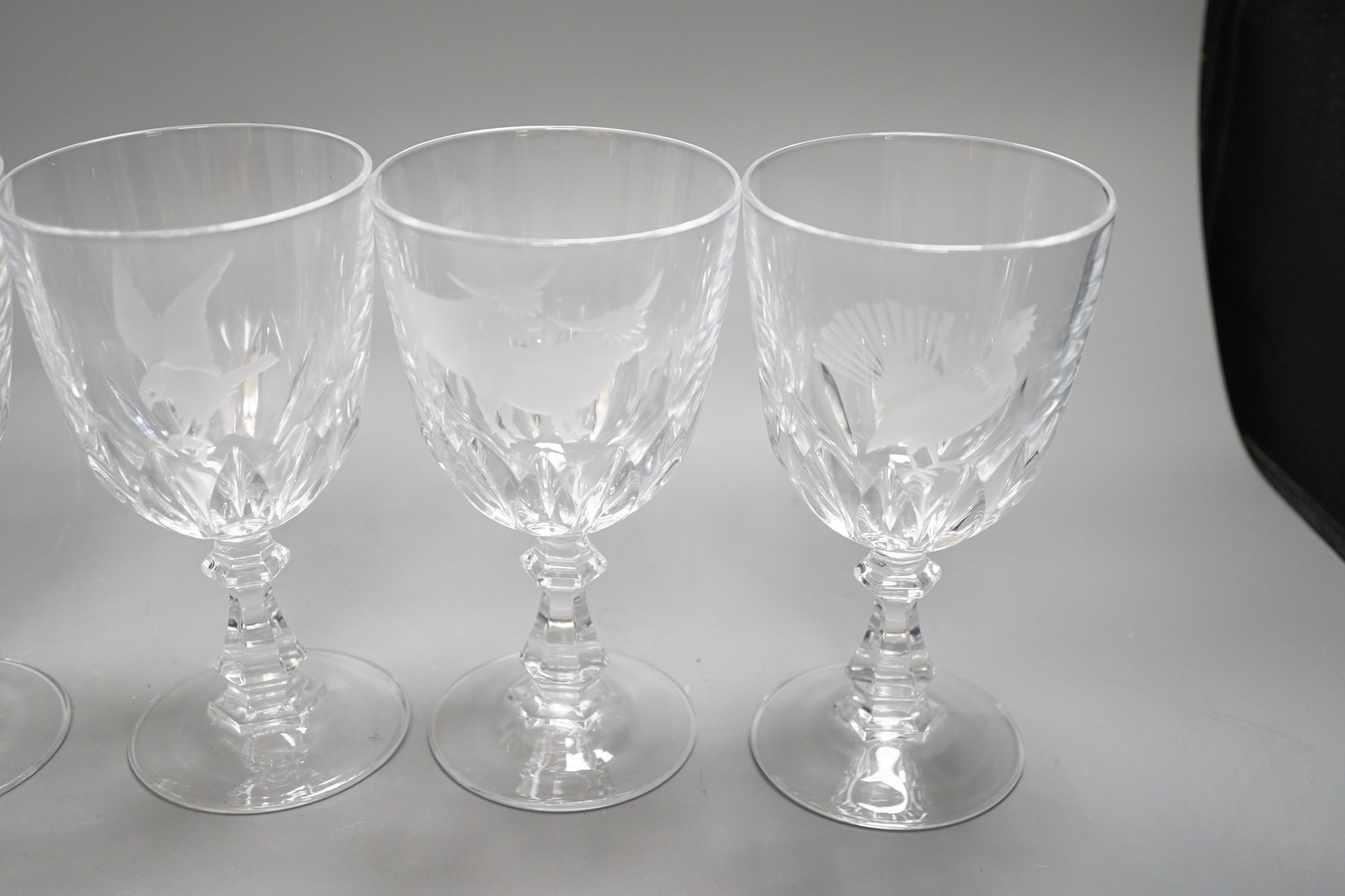 A set of six Scottish wine glasses, engraved with highland cattle and birds, 15cms high